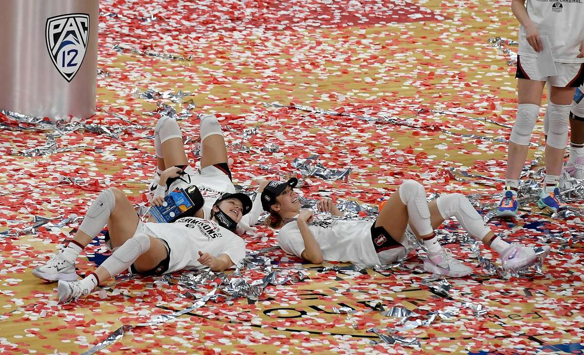 Stanford players bask in the confetti after the Cardinal beat UCLA 75-55 to win the the Pac-12 tourney title in Las Vegas.