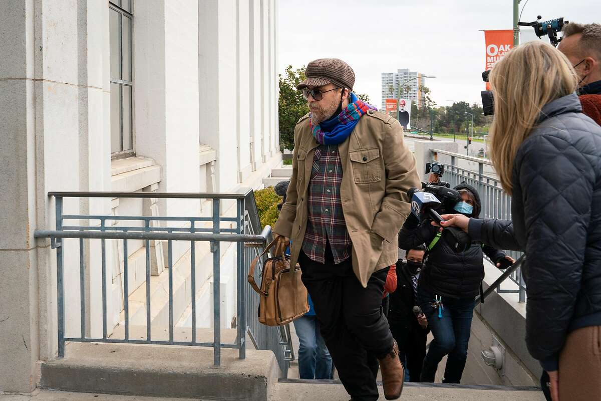 Derick Almena, defendant in deadly Ghost Ship fire, bolts past members of the press while entering his sentence hearing at Rene C. Davidson Courthouse in Oakland, Calif., on Monday, March 8, 2021. During his sentencing, Judge Trina Thompson ruled Almena will spend the rest of his 12 year sentence from home.