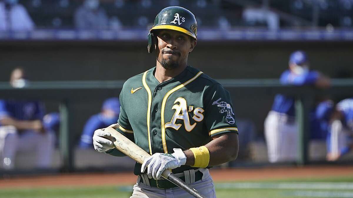 Oakland Athletics's Tony Kemp walks to the dugout after a strike out in a spring training baseball game against the Kansas City Royals, Monday, March 8, 2021, in Surprise, Ariz. (AP Photo/Sue Ogrocki)