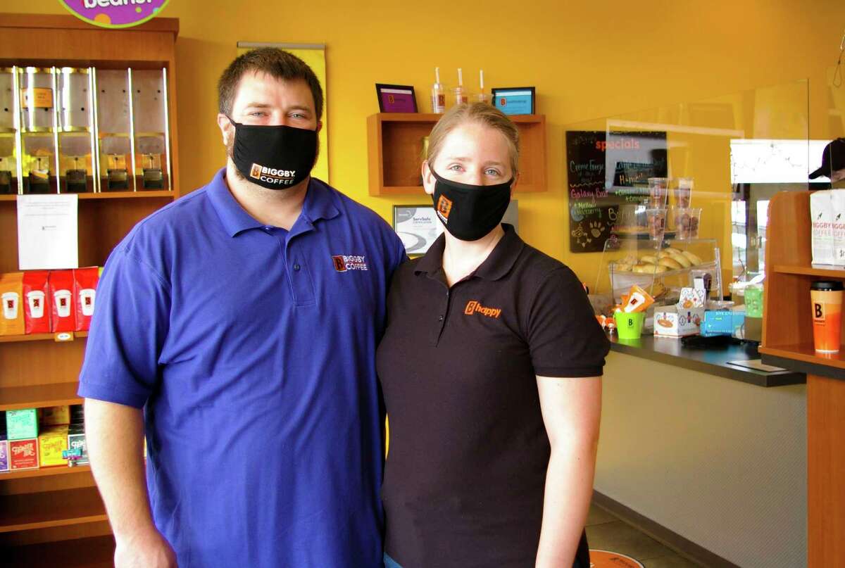 Cory and Norma Psycher and Jim Hop purchased Biggby Coffee in Midland last fall. They plan to open a second Midland location this year. (Photo by Niky House)