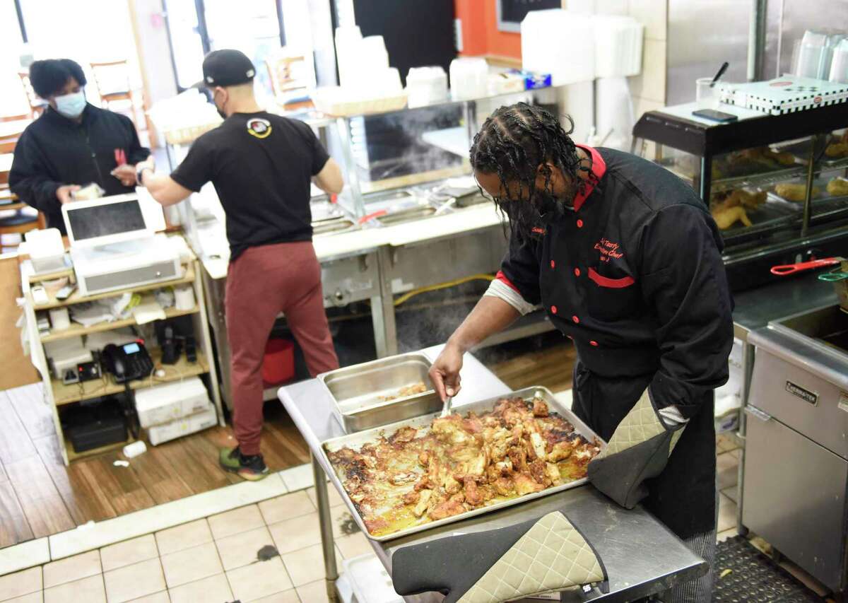 Soul Tasty co-owner Jean Gabriel in late February 2021 at his Stamford, Conn. restaurant. More than 28,500 Connecticut workers in the food and accommodations industry were seeking jobs, according to the state Department of Labor.