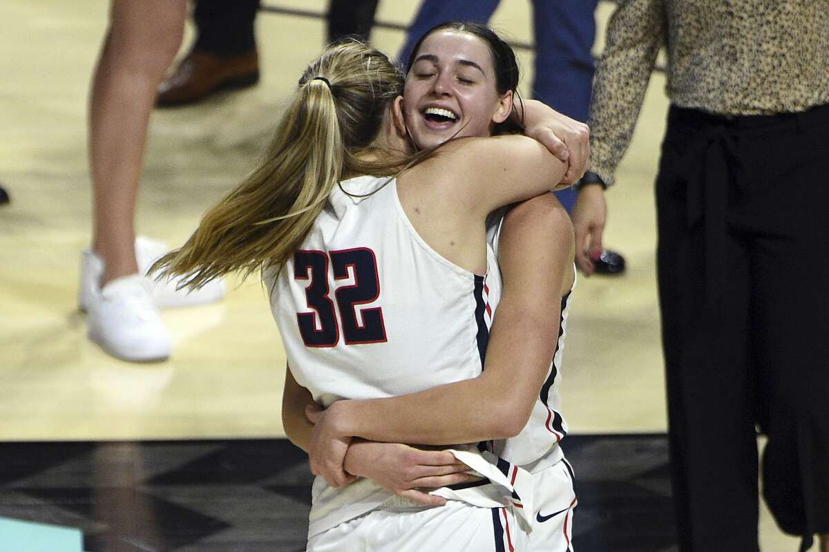 Gonzaga guard Jill Townsend (32) and forward Jenn Wirth embrace after Townsend’s jumper upended BYU.