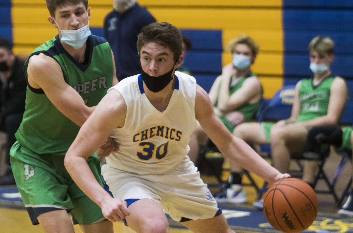 Midland High's Drew Barrie, seen here in action in a Feb. 26 game against Lapeer, led the Chemics to a 63-54 win over Saginaw High on Tuesday.