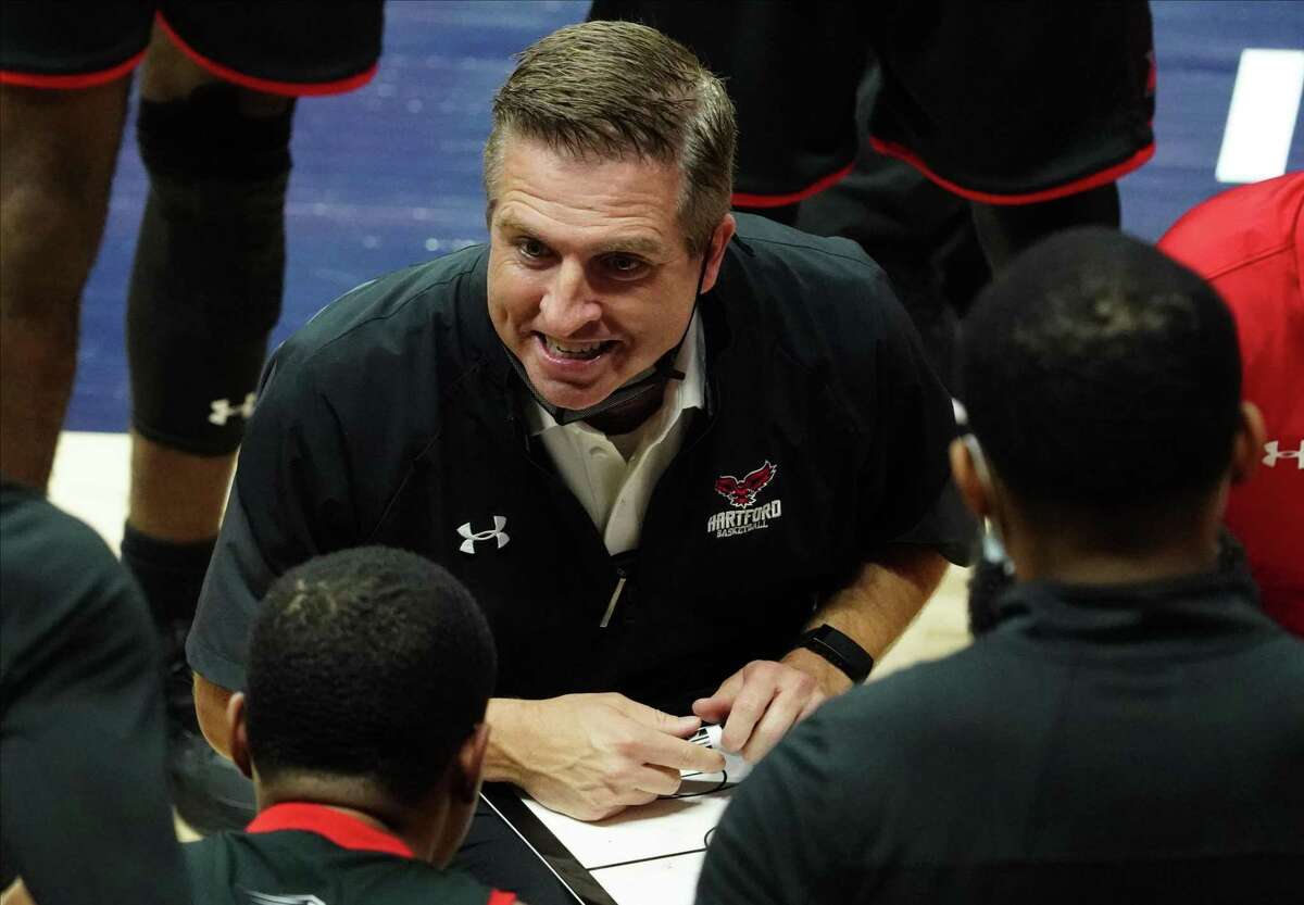 Nov 27, 2020; Storrs, Connecticut, USA; Hartford Hawks head coach John Gallagher talks to his players during a timeout against the Connecticut Huskies in the first half at Harry A. Gampel Pavilion.