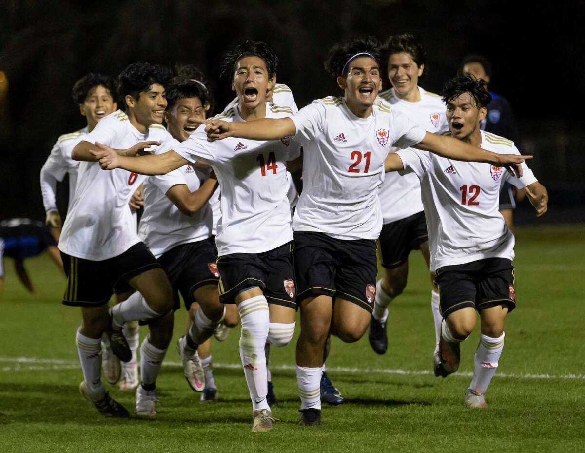 Caney Creek soccer players celebrate after Mario Leon’s game-winning goal with 15 seconds to play in a District 20-5A boys soccer match at Don Ford Stadium, Tuesday, March 9, 2021, in New Caney.