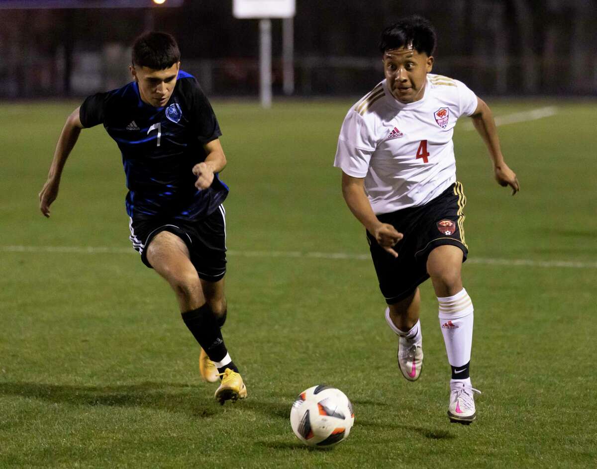 Caney Creek’s Jose Balderas (4) and New Caney’s Fernando Saldana (7) run toward a loose ball during the first half of a District 20-5A boys soccer match at Don Ford Stadium, Tuesday, March 9, 2021, in New Caney.