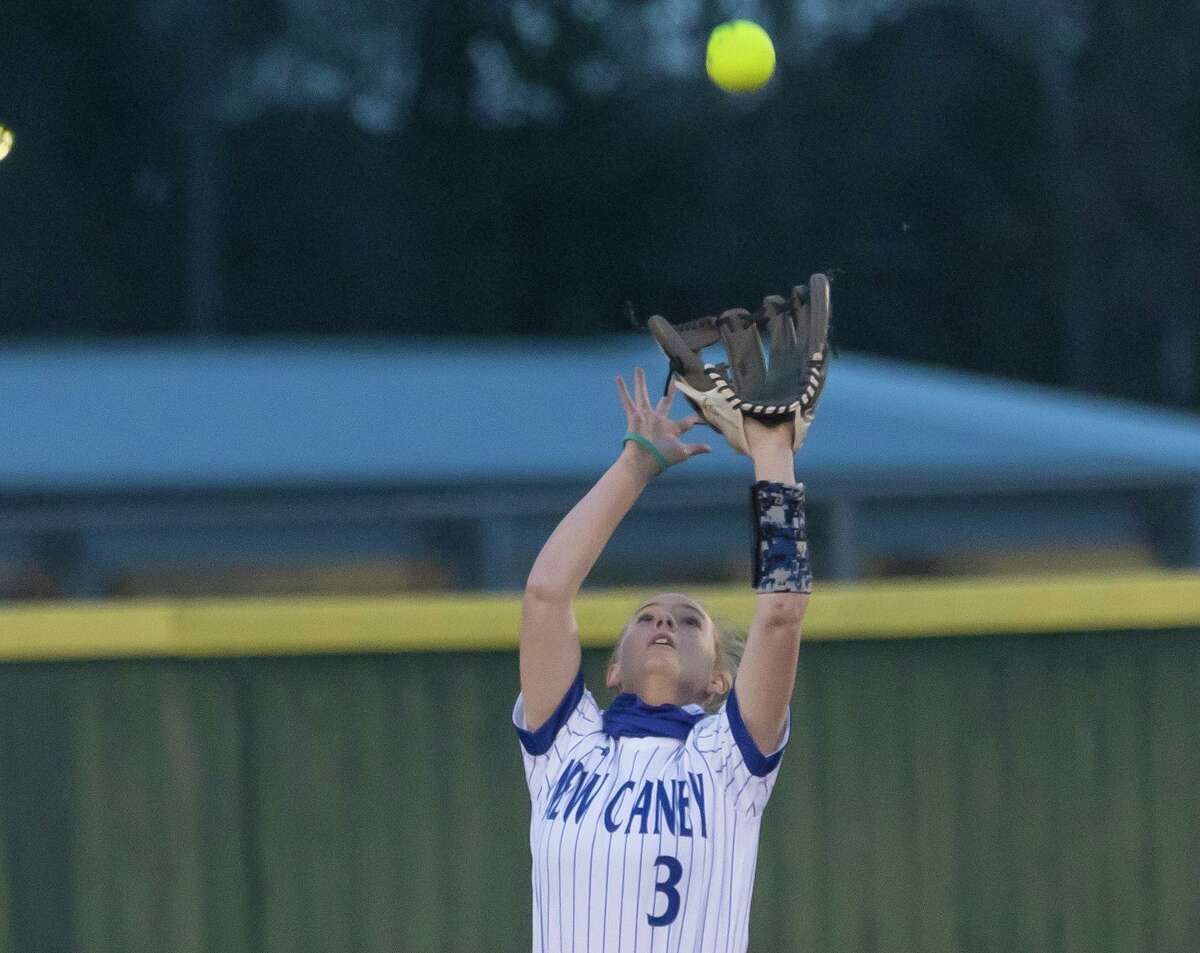 New Caney’s Jackie Walter (3) catches a foul ball during the second inning of a District 20-5A softball game against Lake Creek at New Caney Middle School, Tuesday, March 9, 2021, in New Caney.