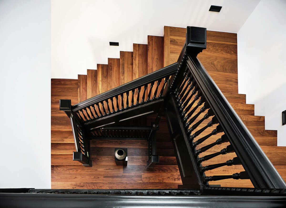 One of the few original features to remain is the central staircase banister, which provides a striking contrast to the modern look of the rest of the home.