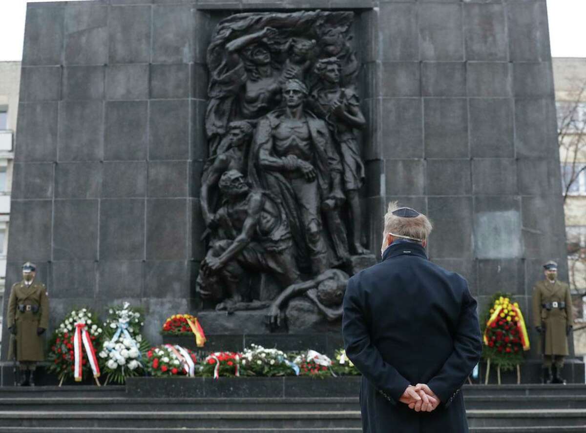 A wreath is laid at the monument to the Heroes of the Warsaw Ghetto in Warsaw, Poland, on Wednesday, Jan. 27, 2021, to recognize Holocaust victims.