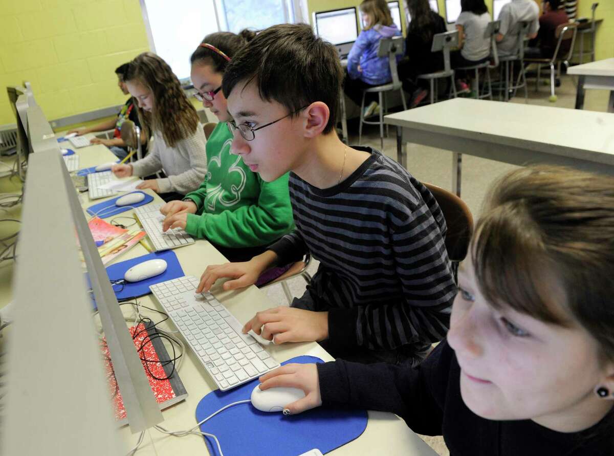 Students at work on their computers as part of trainings Johnson School in Bethel, Conn. gave students for the new state online tests, called Smarter Balanced Assessment, Friday, Feb. 21, 2014.
