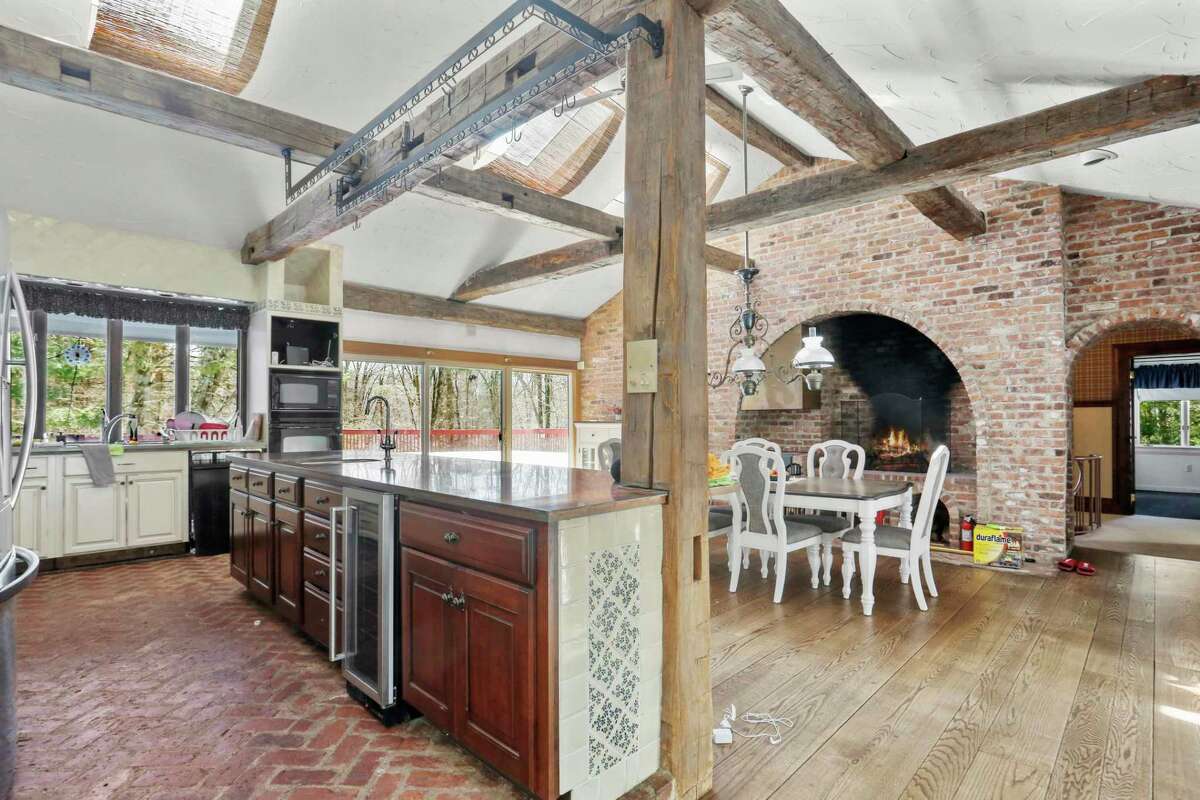 Eat-in kitchen with fireplace at 3 Sweetbriar Trail, Easton.