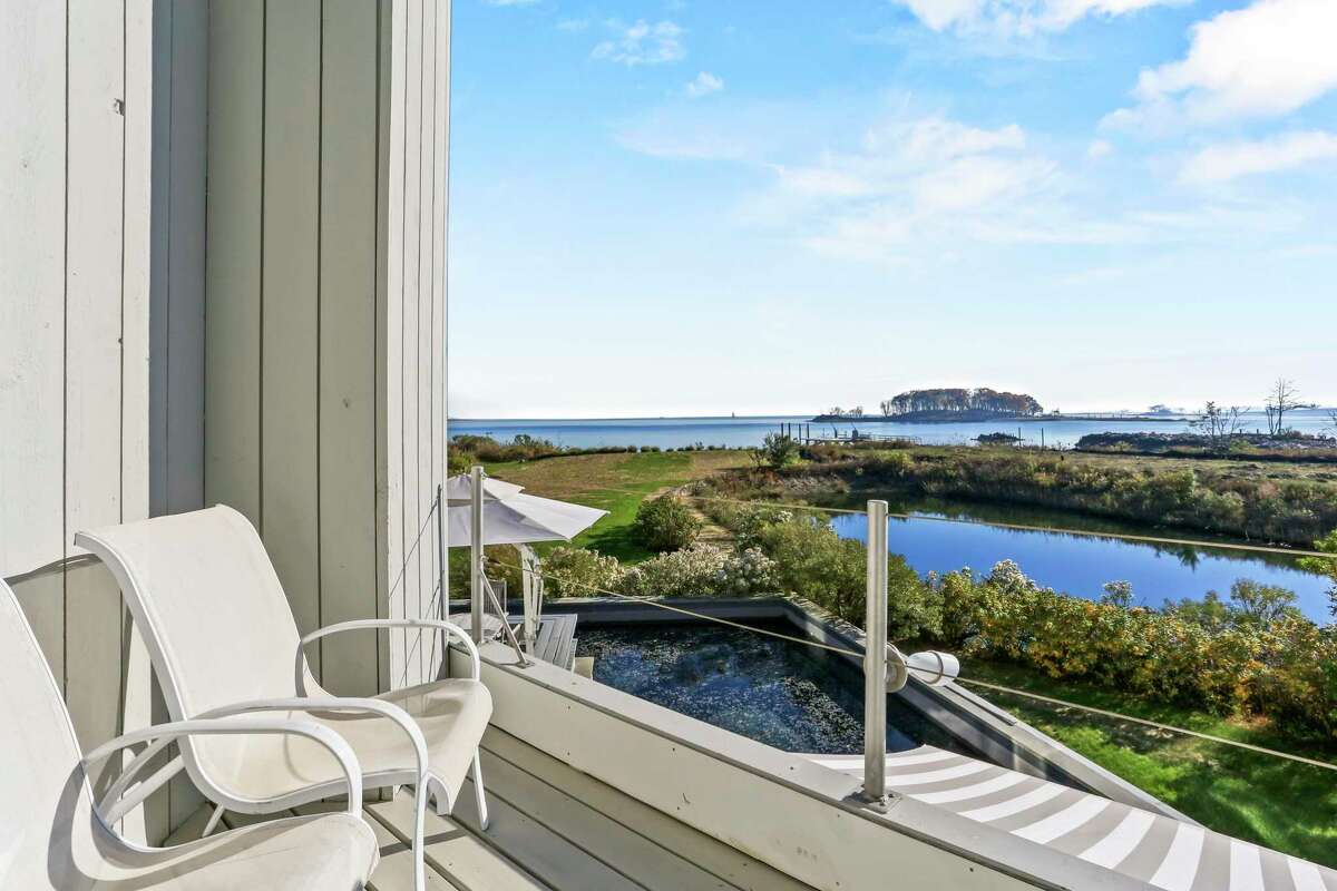 Second floor balcony with view of a lagoon and Long Island Sound at 8 Langdon Road, Westport.