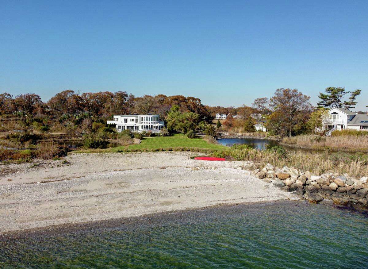 Private sandy beach at 8 Langdon Road, Westport.