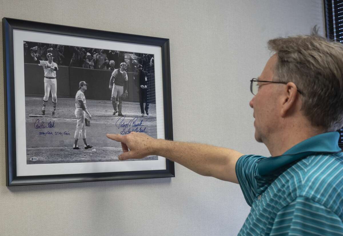 Michael Banschbach talks about a signed photo from the 1975 World Series game where Carlton Fisk watches his hit stay fair for a walk-off homerun as Reds pitcher, Pat Darcy and Johnny Bench, catcher, hope it goes foul.