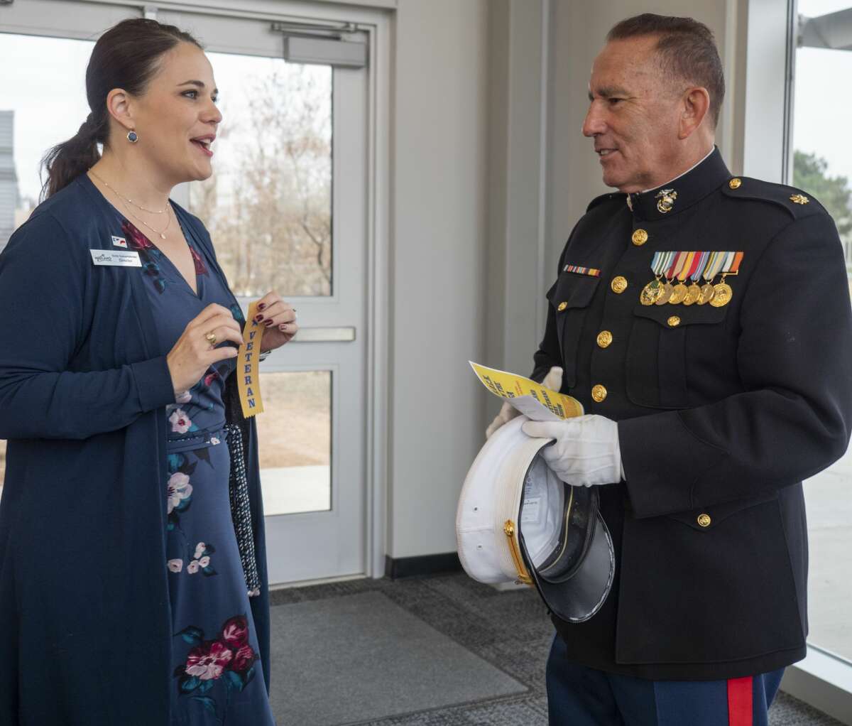 Anita Gamertsfelder talks with Major Ramon Armendariz, USMC, Nov. 11, 2019 at the annual MISD Veterans Day Show at Bowie Fine Arts Academy.