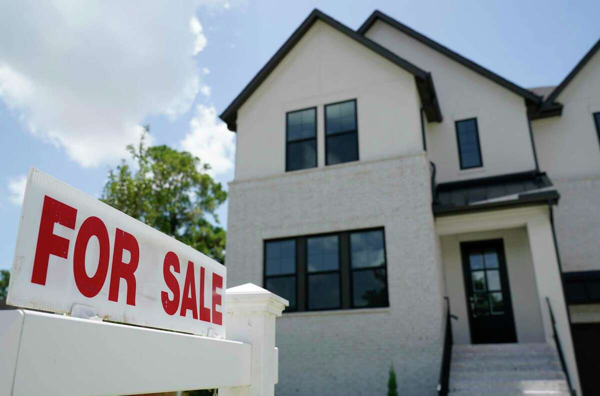 A real estate sign of an area realtor is displayed outside a home for sale Thursday, July 30, 2020, in Houston. Since then, median home prices have climbed by double digits, but the market here wasn’t as red-hot as other pandemic-era migration hot spots such as Austin, Phoenix, Boise and Sacremento, so the shock of the slow down here won’t be as sharp.