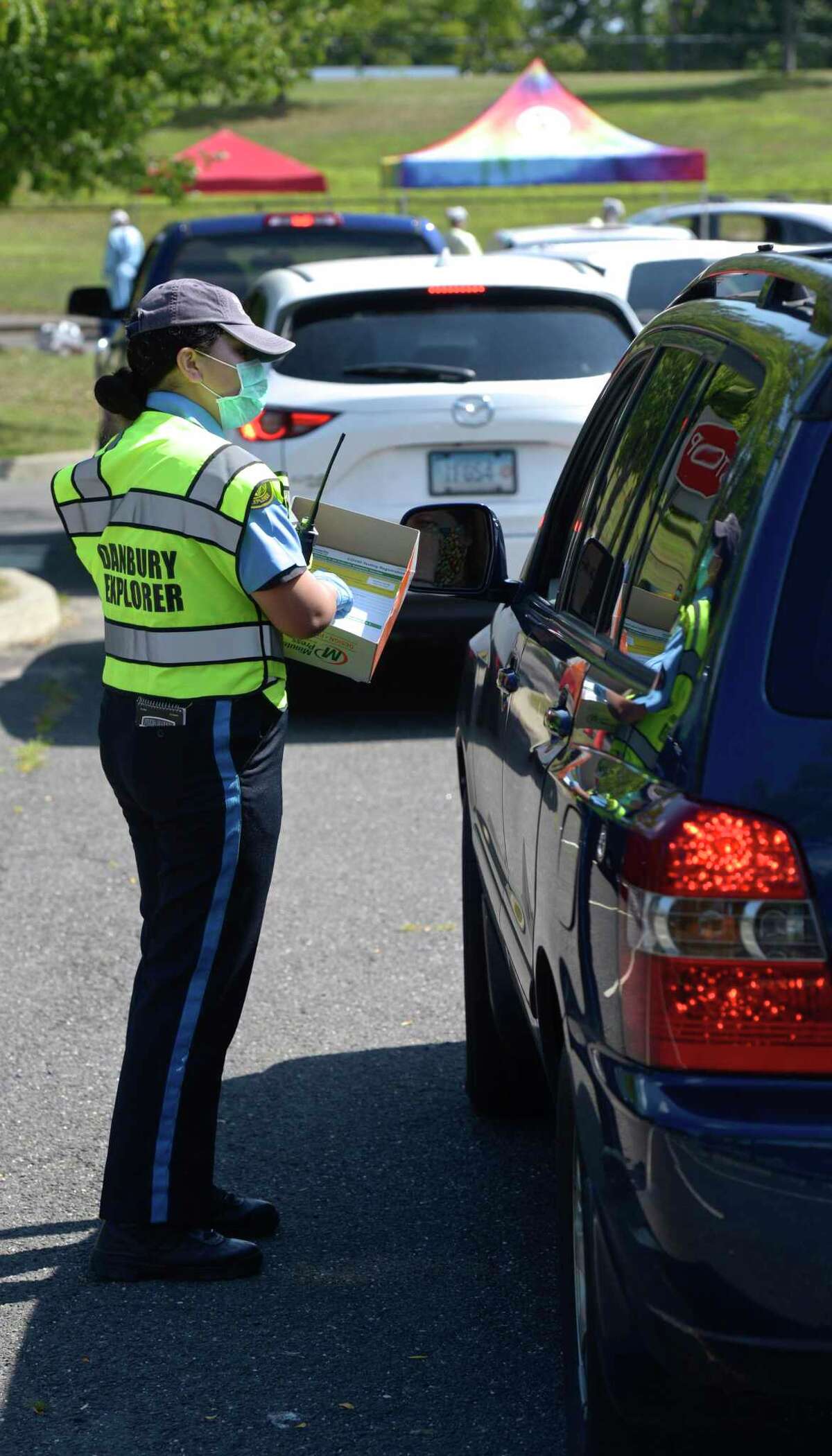 ‘Raring to do something’ Young Danbury police cadets help with COVID