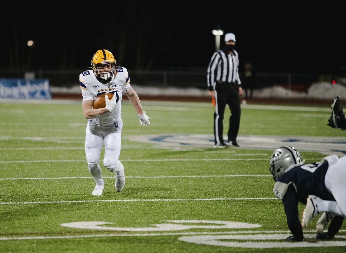 UAlbany redshirt freshman wide receiver Mike Gray races down the field against New Hampshire in a Colonial Athletic Association football game Friday, March 5, 2021, in Durham, N.H. (China Wong/UNH athletics)