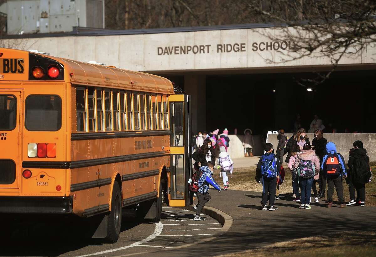 Students flood in for the first day of return to full-time in-person learning at Davenport Ridge Elementary School in Stamford, Conn. on Wednesday, March 10, 2021.