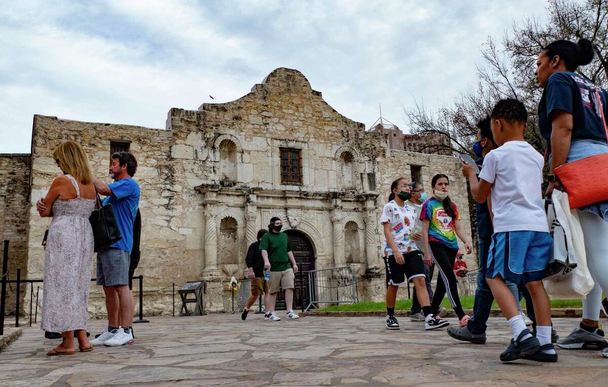 Some people wear masks and some do not as they visit the Alamo in March. The Alamo myth has framed the battle for Texas independence as a noble crusade for individual liberty, a rebellion against Mexican oppression, rather than accurately depicting it as a move by land speculators and slaveholders to protect their economic interests.