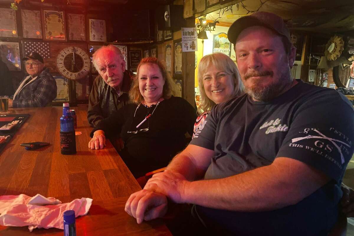 Tom Nelson, Robbie Nelson, Suzanne Hicks and Gordon Hicks hanging out at Airport Bar on a Saturday night.