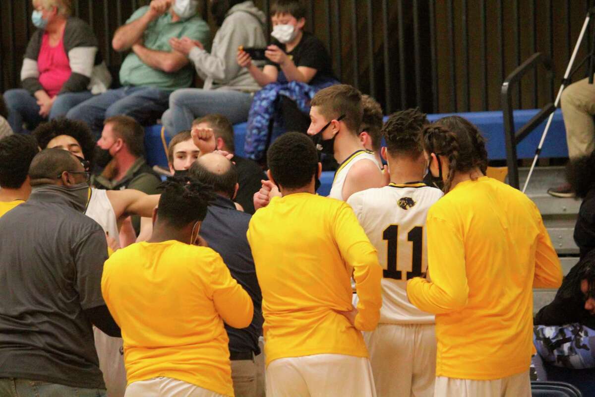 Baldwin players gather in huddle during the Mesick game on Thursday. (Star photo/John Raffel)