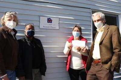 Julien Beresford, Westport Rotary Club foundation chair, recently presented a $1,075 check to Helen McAlinden, Homes with Hope president, in the presence of Lynn Abramson, (left), ASAP, (after school academic), Program director and Paris Looney, Homes with Hope vice president.
