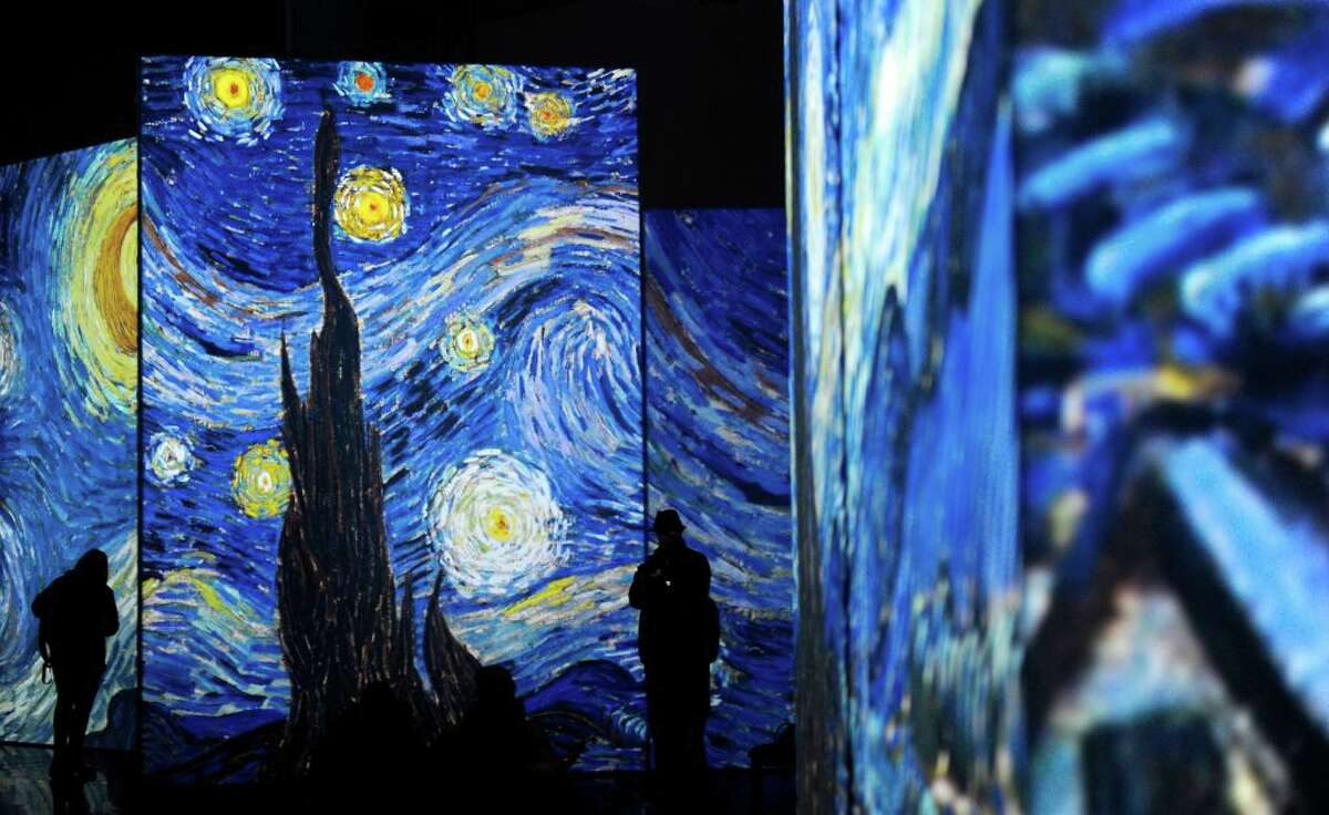 People visit the exhibition "Van Gogh Alive - The Experience", life and work of Vincent Van Gogh from 1880 until 1890 on February 02, 2018 in Sevilla. Photographs and videos combined with a unique system that incorporates over 50 high-definition projectors, graphics and multi-channel surround sound to create multi-screen environments showing the art of Vincent Van Gogh.