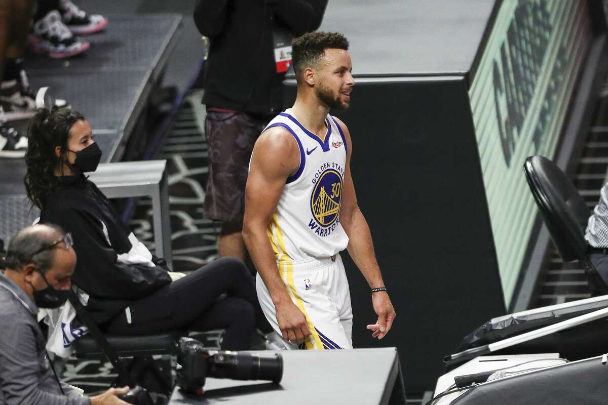 Golden State Warriors' Stephen Curry reacts off the field against the Los Angeles Clippers on March 11, 2021.