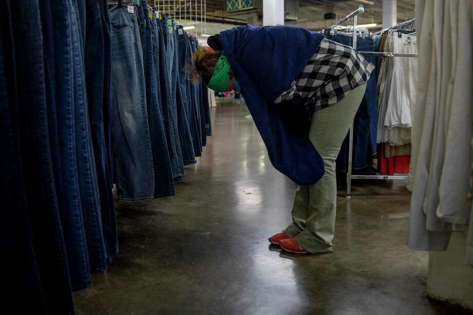 After looking through the section of shoes and clothes at the Salvation Army, none of which would protect her from the oncoming subfreezing temperatures, Hester broke down in tears. Photo: Jessica Phelps /San Antonio Express-News / **MANDATORY CREDIT FOR PHOTOG AND SAN ANTONIO EXPRESS-NEWS/NO SALES/MAGS OUT/TV  © 2021 San Antonio Express-News