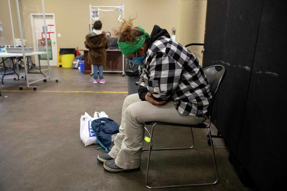 After a seven-hour-long journey to find warm boots and seek shelter, Hester goes to Haven for Hope’s emergency shelter intake on the Friday before the deadly winter storm. Photo: Jessica Phelps /San Antonio Express-News / **MANDATORY CREDIT FOR PHOTOG AND SAN ANTONIO EXPRESS-NEWS/NO SALES/MAGS OUT/TV  © 2021 San Antonio Express-News