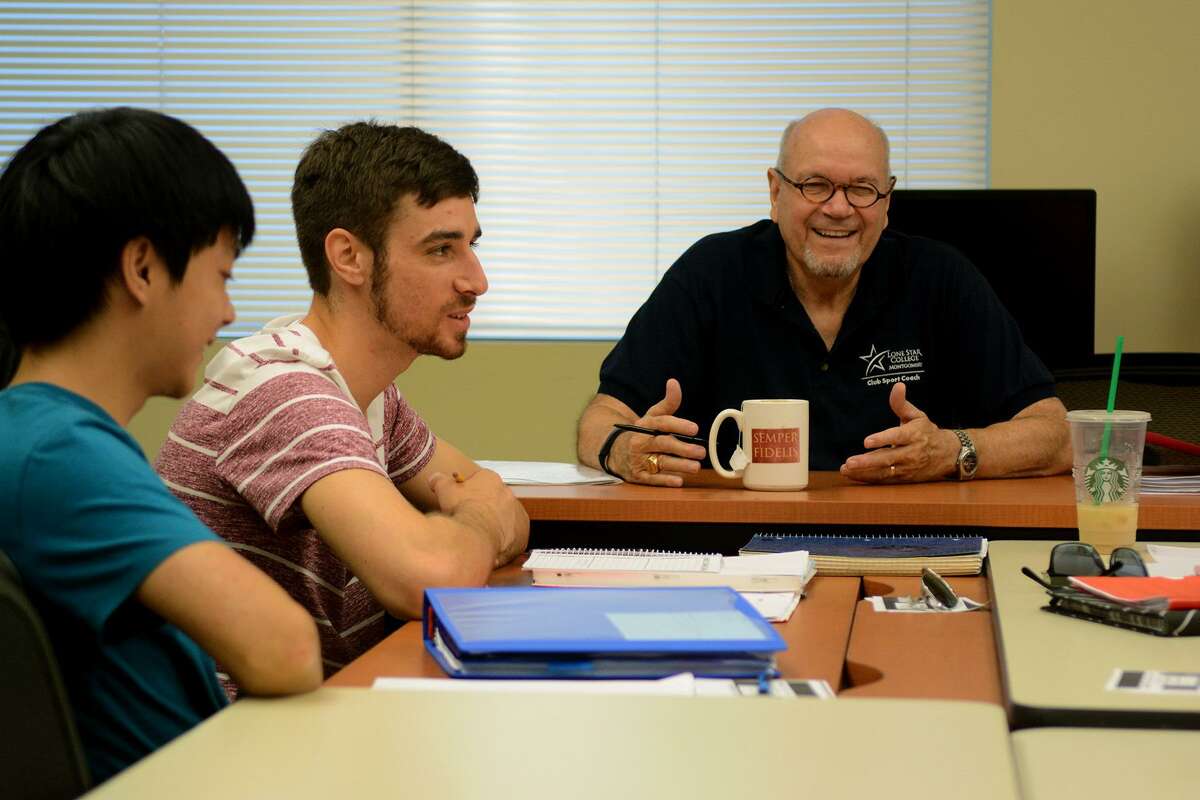Professor David Parsons, from right, leads his students, including Josh Sandros, 23, of Spring, a family friend of a veteran, and Vuong Nguyen, 20, the son of a veteran, in a group discussion during their creative writing class for veterans and family members at Lone Star College - Montgomery on Sept. 15, 2015. The college will offer scholarships for veterans to take creative writing classes in the fall.