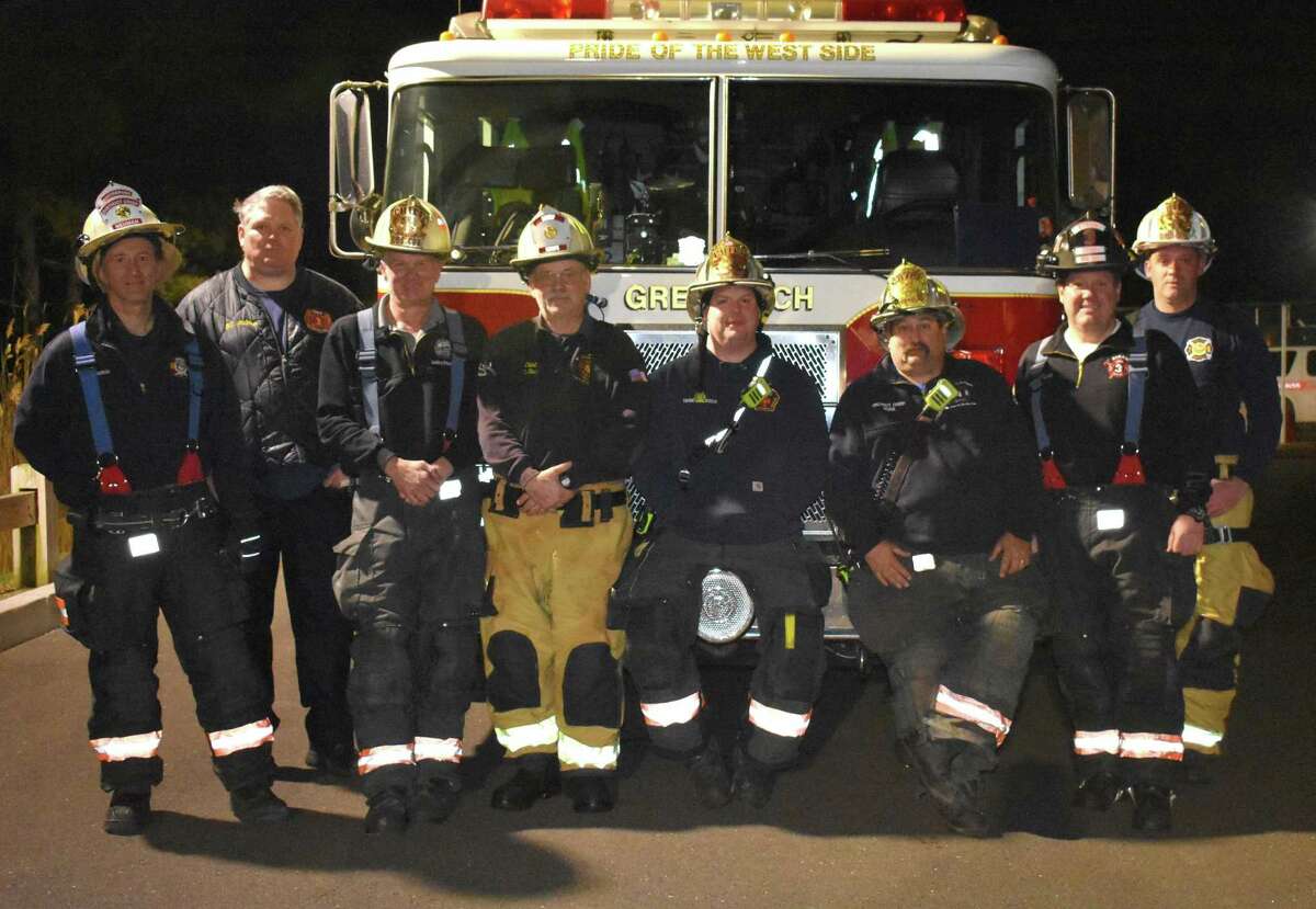 Firefighters from left, Richard Neuman of Station 1, Fire Chief Joe McHugh, Gary Wilson of Station 2, Rick Strain of Station 6, Joe Gianfrancesco of Station 5, Mike Hoha of Station 4, Dave Walko of Station 3, and Al Farquar of Station 7 pose together at the North Street Training Center Thursday, March 11, 2021.
