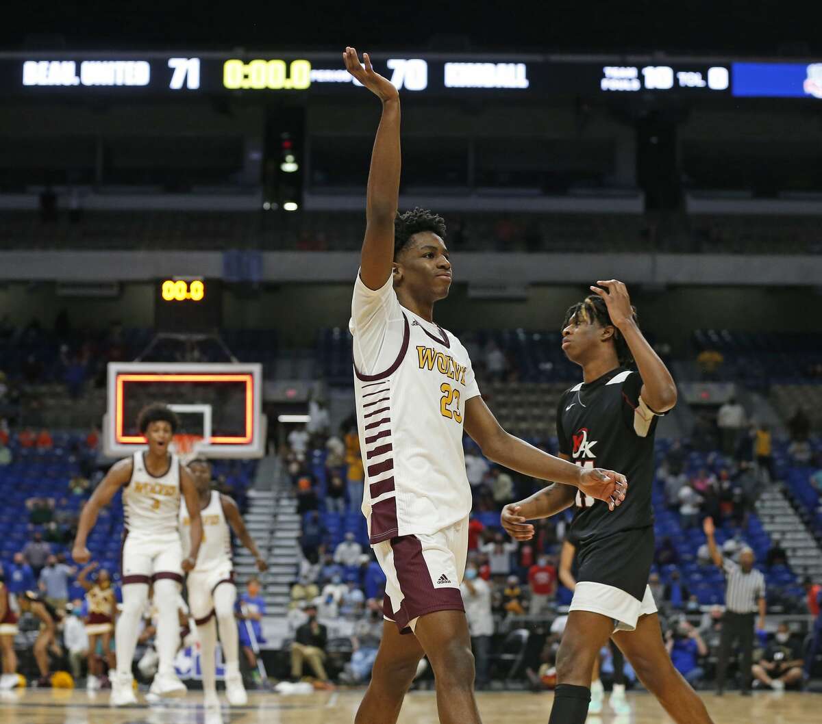 After Beaumont United Terrance Arceneaux #23 hit a three point shot inOT, Dallas Kimball Ronald Gustus #11 walks off the court. UIL boys Class 5A basketball state championship game on Friday, March 12, 2021 at the Alamodome.
