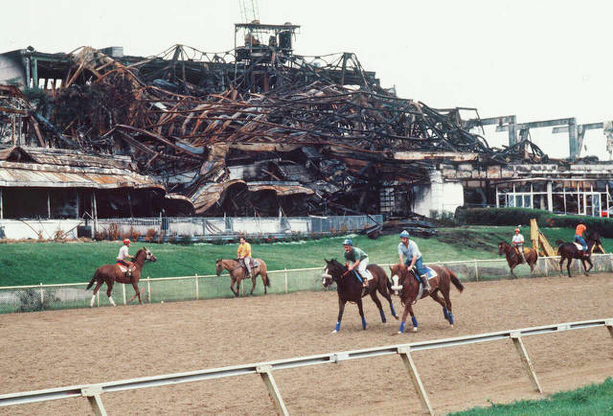 Horses work out on the track at Arlington Park after the fire destroyed destroyed the facility in July 1985. Dick Duchossois. the man synonymous with Arlington Park poured millions into the track he bought in 1983, and millions more into a glorious rebuild after a devastating fire in 1985, before merging his creation with Churchill Downs in 2000. But he has no regrets that the 326 acres, including the 94-year-old track, are for sale and destined to be developed into something else. (Daily Herald via AP)