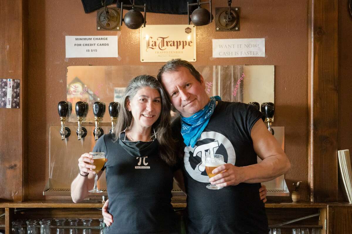 Pi Bar owners Jen Garris, left, and Rich Rosen behind the bar at their restaurant in San Francisco on March 12, 2021.
