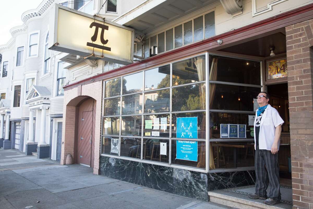 Co-owner Rich Rosen stands at the doorway of his restaurant, Pi Bar, in San Francisco on March 12, 2021.