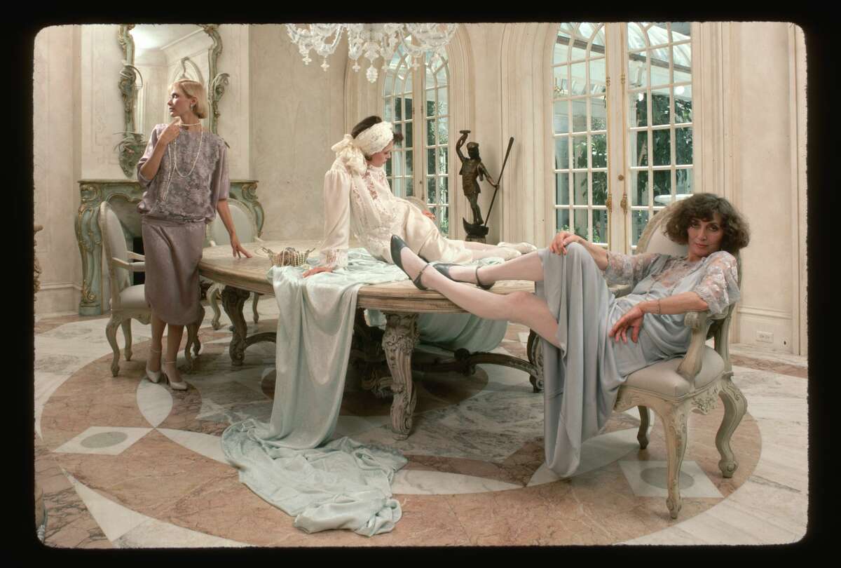Designer Jessica McClintock and models pose with some of her fashions at her San Francisco home in 1984.
