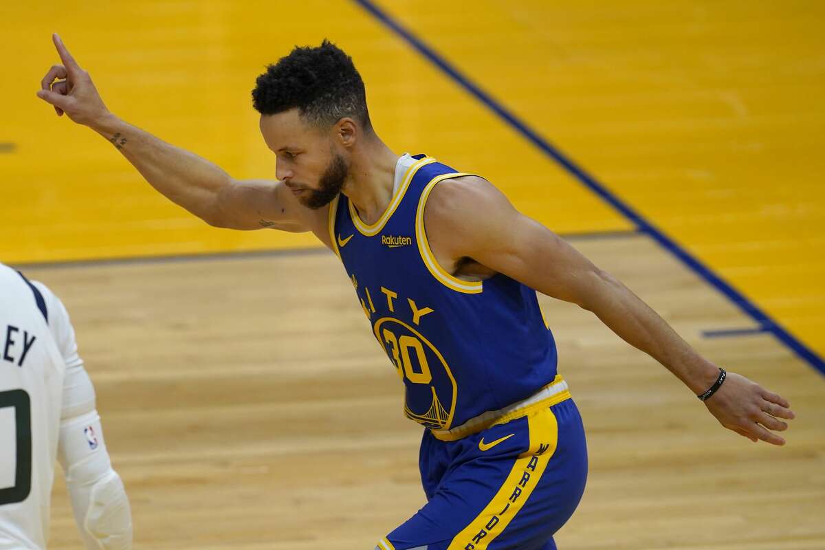 Golden State Warriors guard Stephen Curry reacts after shooting a 3-point basket against the Utah Jazz on March 14, 2021.