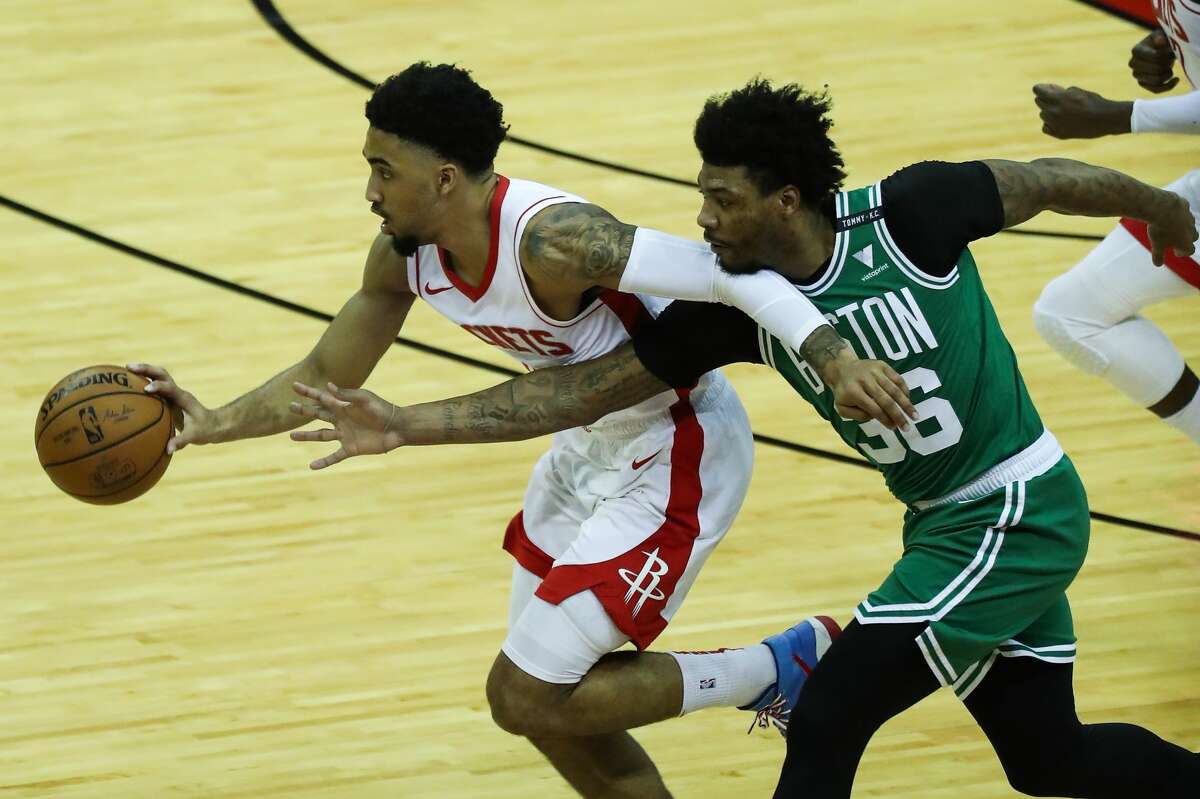 Reigning NBA Defensive Player of the Year Marcus Smart presents an obstacle for the Rockets' backcourt Tuesday in Boston.