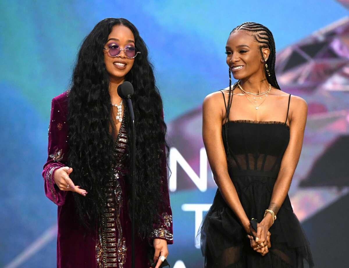 H.E.R. and Tiara Thomas accept the Song of the Year award for 'I Can't Breathe' onstage during the 63rd Annual GRAMMY Awards at Los Angeles Convention Center on Mar. 14, 2021.