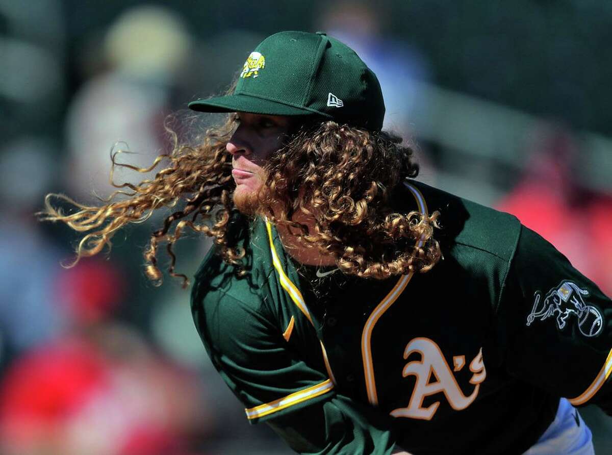 Grant Holmes (67) started for the Oakland Athletics as they took on the Cincinnati Reds at Hohokam Stadium in Mesa, Ariz., on Monday, March 1, 2021.