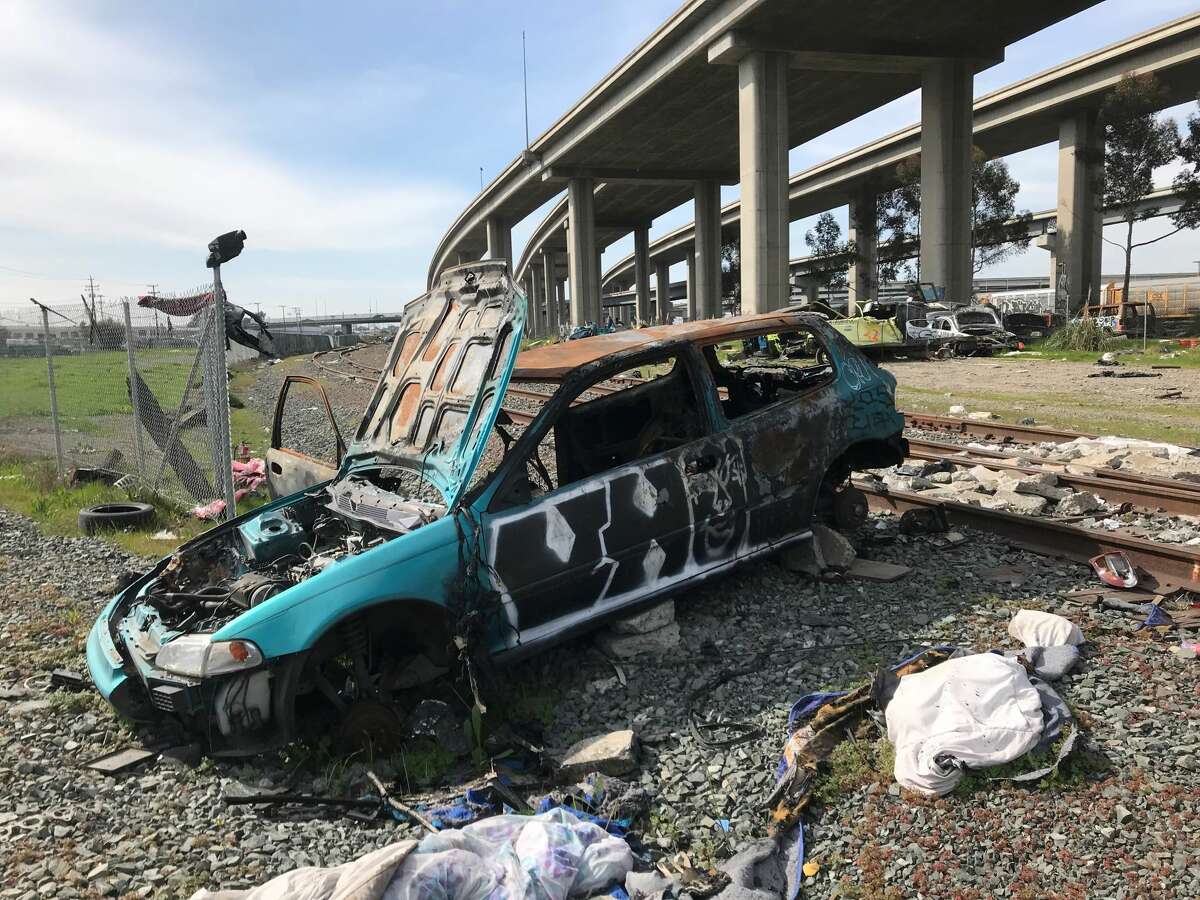 An abandoned car in Oakland, Calif., March 2021.