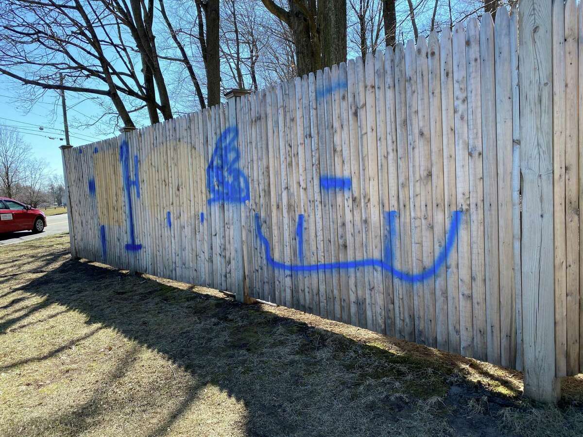 Graffiti seen on the corner of South Avenue and Farm Road in New Canaan has partially been removed.
