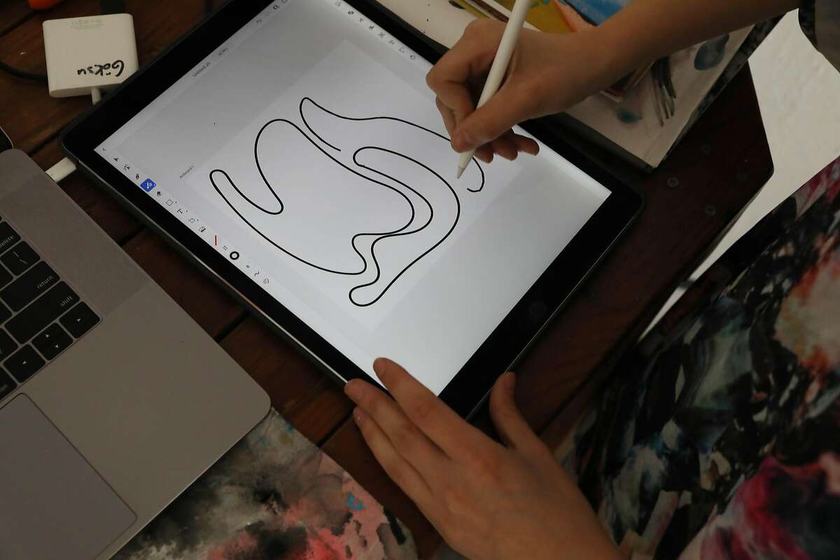 Mixed media artist Göksu Ilgaz Koçakcigil, also known as @skywaterr, works on her digital art Blob series on her tablet in her studio on Friday, March 12, 2021 in San Francisco, Calif.