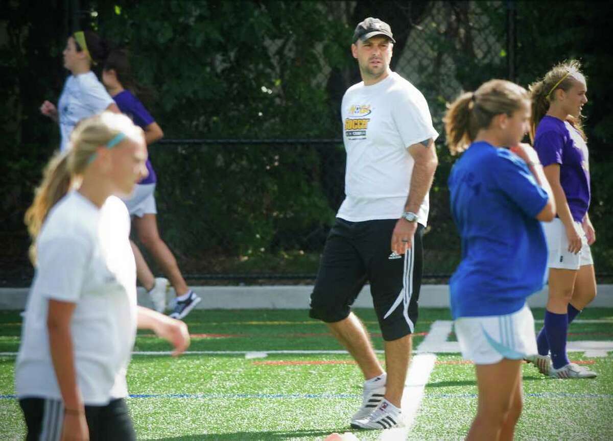 David Flower, head coach of Westhill girls soccer team, the defending state champions, conducts practice at Westhill High School in Stamford, Conn. on Thursday September 9, 2010.