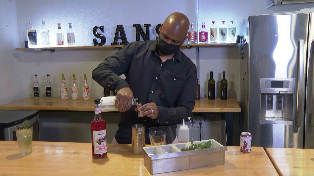 In this March 5, 2021 photo, owner Chris Marshall prepares an alcohol-free cocktail at San Bars in Austin, Texas. According to IWSR Drinks Market Analysis, global consumption of zero-proof beer, wine and spirits is growing two to three times faster than overall alcohol consumption.