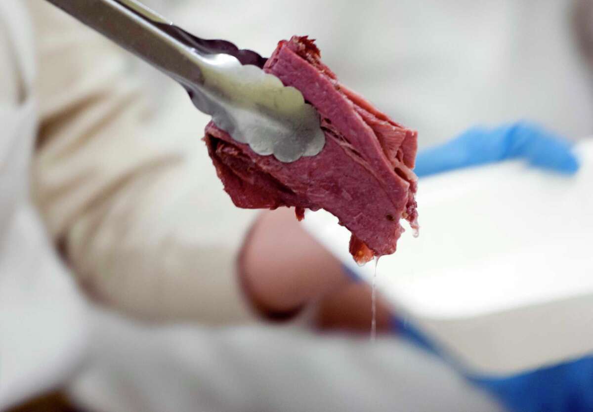 Lunches of corned beef and cabbage were boxed up and handed out for a special St. Patrick's Day drive-thru luncheon at The Bigelow Center for Senior Activities in Fairfield, Conn., on Tuesday Mar. 16, 2021.