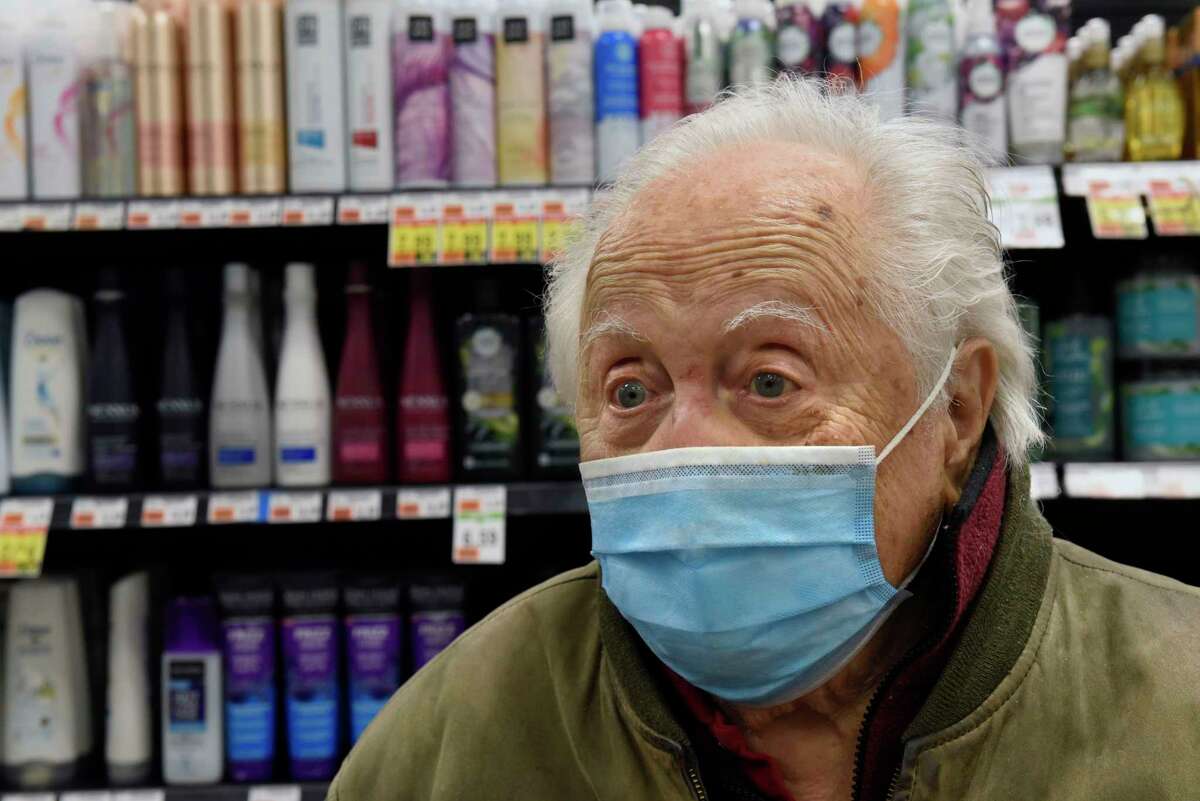Paul Pagiotas, 91, of Clifton Park watches people waiting to be vaccinated for COVID-19 at a “super clinic” held at Market 32 by Price Chopper pharmacy on Wednesday, March 17, 2021 in Clifton Park, N.Y. Pagiotas already received his two dose vaccine from the Veterans Affairs.(Lori Van Buren/Times Union)