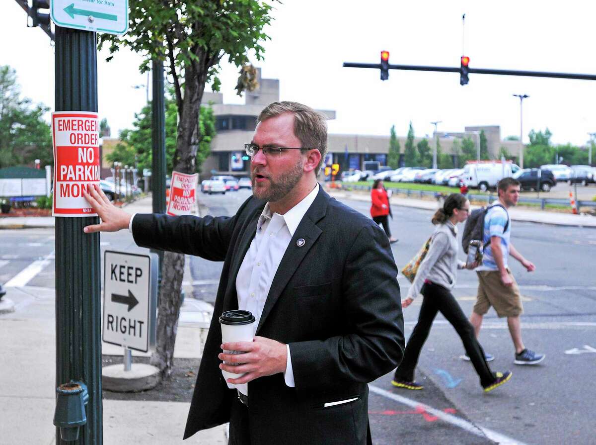Douglas Hausladen explaining a new traffic pattern along George Street in New Haven.